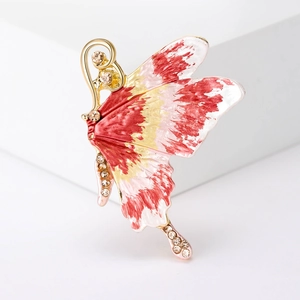 Detail of butterfly brooch with colorful enamel wings and sparkling inlaid rhinestones