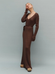 Detail of chocolate brown ribbed knit maxi dress showing deep V-neck and drawstring waist