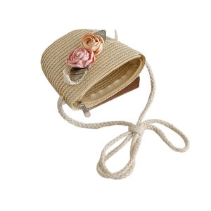 Children's woven straw crossbody bag with floral lace decor and pearl accents