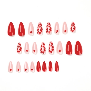 Pink and red heart patterned long almond press-on nails set on a clean white background