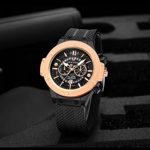 Detail of rose gold octagonal bezel and black textured dial with chronograph sub-dials