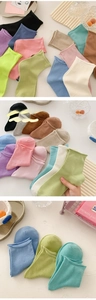 Close-up of candy-colored mid-calf cotton socks featuring decorative lettuce edge cuffs
