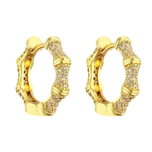 Elegant gold bamboo hoop earrings with micro-paved clear cubic zirconia on white background