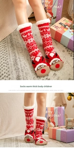 Detail of red Christmas thermal socks with reindeer patterns and warm fleece lining