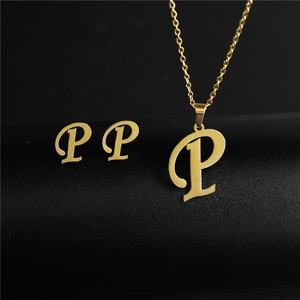 Golden stainless steel jewelry set featuring letter P pendant necklace and matching studs