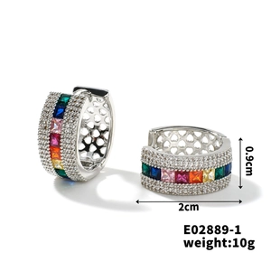 Macro detail of rainbow gemstone hoop earrings with micro-paved cubic zirconia accents