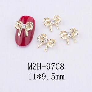 Détail du nœud doré pour ongles avec strass, dimensions 11x9,5mm pour décoration d'ongle