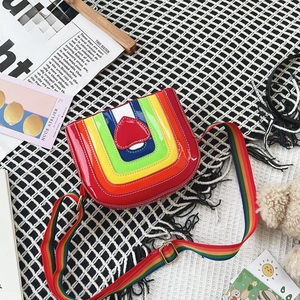 Detailed close-up of rainbow heart crossbody bag with glossy finish and matching strap