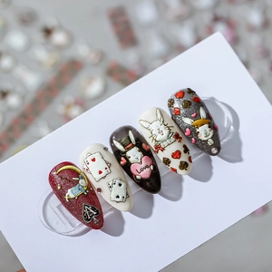 3D embossed cartoon nail stickers with rabbit and heart designs and rhinestone accents