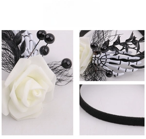 Detailed macro view of Gothic Halloween headband with white roses and skull hands