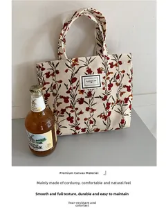 Close-up of vintage floral corduroy tote bag with Pleasant Time label and soft texture