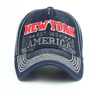 Close-up of vintage navy cotton baseball cap with 3D New York embroidery and distressed fabric