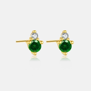 Close-up of gold S925 sterling silver studs with green and white round gemstones
