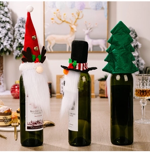 Detailed set of Christmas wine bottle covers featuring Santa, snowman and tree motifs