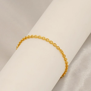 Minimalist 18K gold plated stainless steel O-chain bracelet on white cylinder display