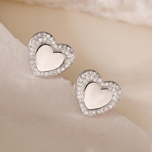Elegant heart-shaped silver stud earrings with sparkling cubic zirconia inlay detail