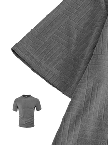 Detail of dark grey short sleeve set showing the 3D jacquard geometric textured fabric
