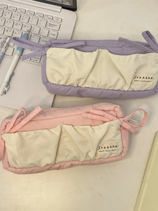 Large capacity bow pencil case in purple and pink fabric with split compartments