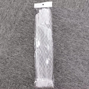 Detailed view of white lace bridal gloves in transparent hanging plastic packaging