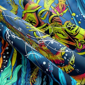 Detailed view of the soft knitted fabric with vibrant ocean-themed digital printing