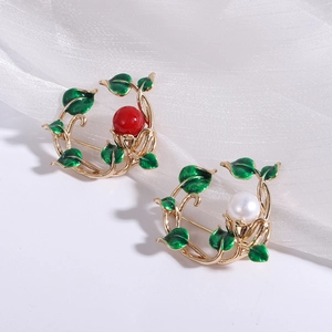 Fashionable botanical wreath brooches with red beads and white pearls on white silk