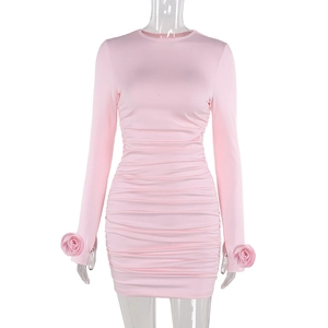 Close-up of 3D rose flower cuff detail on elegant pink long sleeve bodycon dress