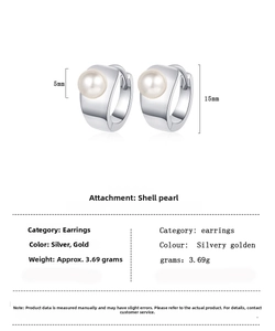 Macro view of 15mm pearl hoop earrings with 5mm white shell pearl and polished finish