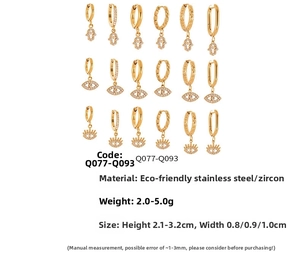 Macro view of gold stainless steel Evil Eye earrings with sparkling 5A cubic zirconia