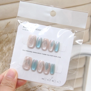 Cat eye press-on nails with mermaid gradient and white abstract patterns in 10-piece set
