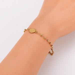 Gold-plated stainless steel beaded bracelet with a vintage religious oval pendant charm