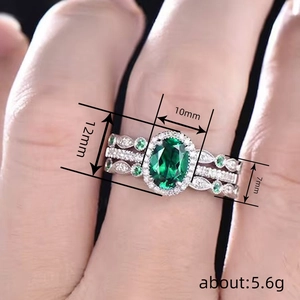 Luxury 3-piece set featuring oval green gemstone and diamond halo rings in silver