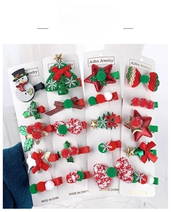 Detailed set of Christmas hair clips for kids featuring snowman and tree motifs on cards