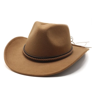 Close-up of camel felt fedora hat featuring a woven brown band and vintage wool texture