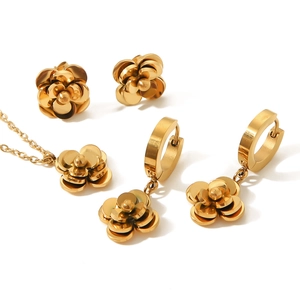 Elegant rose gold camellia jewelry set with flower earrings and matching necklace