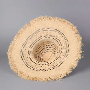 Women's hollow raffia sun hat with wide fringe brim for beach sun protection