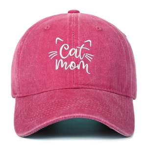 Close-up of Cat Mom embroidery on a washed pink cotton baseball cap for pet lovers
