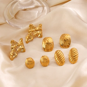 Minimalist gold geometric earring set featuring lava, hammered oval, and ribbed designs