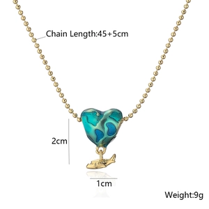 Gold ball chain necklace featuring a blue heart globe and airplane pendant measurements