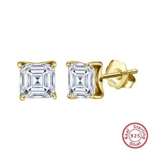Detailed macro of gold S925 sterling silver stud earrings with square zircon stones