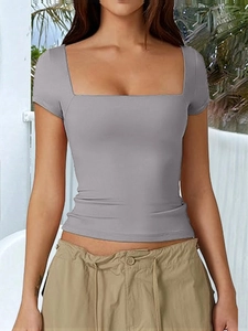Detail of grey square neck short sleeve slim fit T-shirt worn by model in nature