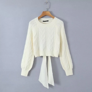 Chic cable knit backless sweater with elegant bow-knot ties in creamy off-white