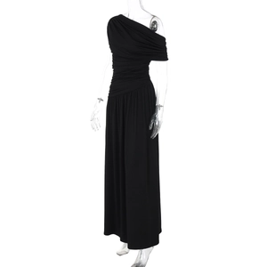 Detailed view of the one-shoulder draped waist and ruching on a black evening dress