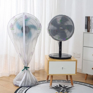 Detailed view of dust-proof fan covers with purple grape patterns in a cozy home setting