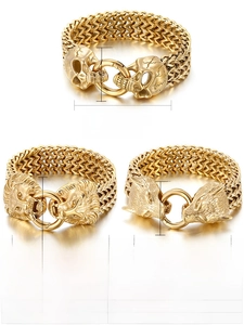 Close-up of gold punk bracelets showing skull, lion, and wolf head metal clasps