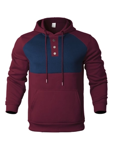 Detail view of burgundy and navy contrast hoodie with three-button placket and kangaroo pocket