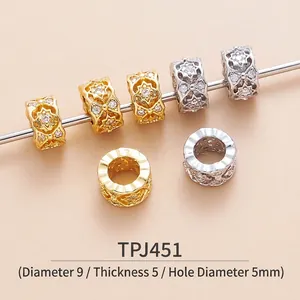 Detailed macro of 9x5mm brass beads with zircon inlay for jewelry making and DIY bracelets