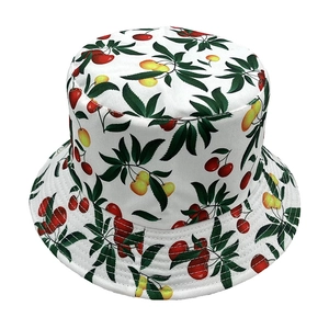 Detailed close-up of cherry pattern print on double-sided sun protection bucket hat