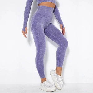 Close-up of purple acid-wash seamless yoga set featuring thumb holes and ribbed texture