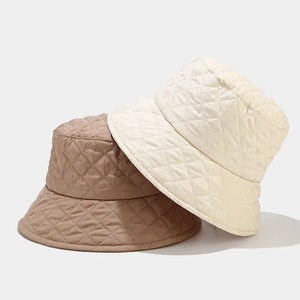 Chic quilted fisherman bucket hat for women in beige and brown with classic diamond patterns