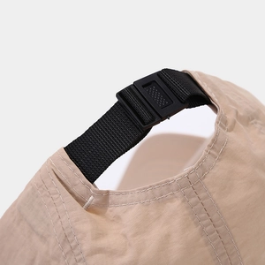 Close-up of adjustable buckle and nylon strap on quick-dry outdoor baseball cap
